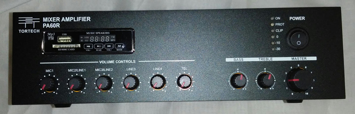 Front Panel: Features the integrated media display and playback buttons on the top-left (USB / SD / Bluetooth / FM), individual rotary gain controls for Mic 1, Mic 2, Phono, Aux, plus Bass, Treble, and Master Volume dials, alongside an illuminated push-button power switch.
